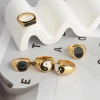 A new European and American Instags-style simple 14K golden dial jewelry for women, a French retro black oil-dripping stainless steel ring details Picture